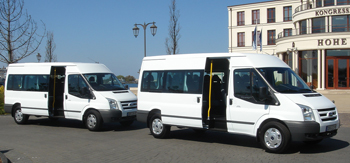 14-seater Ford Transit minibuses from JOYRIDE in front of the congress center Hohe Duene in Rostock - Warnemuende